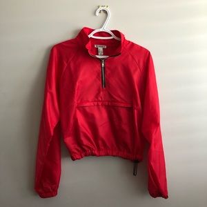 red cropped windbreaker